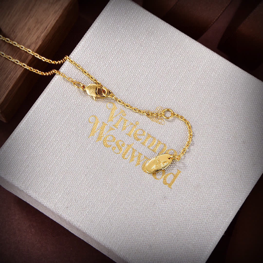 Vivienne Westwood Gold Tone Safety Pin & Hat Pendant Necklace